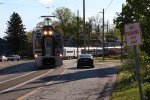 MU 41 weaves through the street with a morning westbound
